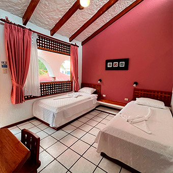 Classic double room with two full beds.